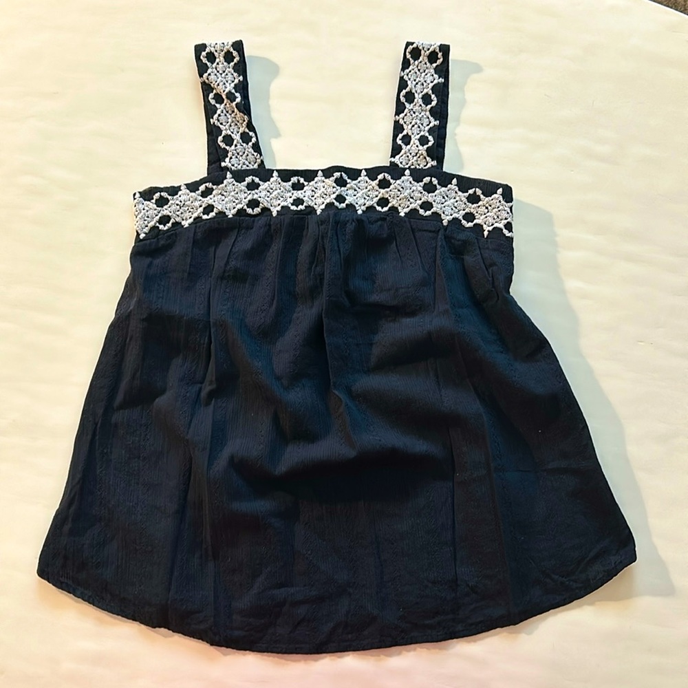 Black and white embroidered tank top.